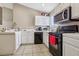 Open kitchen with white cabinetry, neutral walls, and tile flooring at 628 Bay Bridge Dr, North Las Vegas, NV 89032
