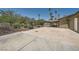 Spacious backyard featuring mature trees, landscaping, and a covered patio area perfect for outdoor enjoyment at 6315 Eldora Ave, Las Vegas, NV 89146