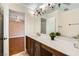 Bathroom with single sink vanity and views into the main bedroom at 6315 Eldora Ave, Las Vegas, NV 89146