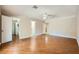 Large bedroom with wood floors, ceiling fan, and doors to the bathroom and walk-in closet at 6315 Eldora Ave, Las Vegas, NV 89146
