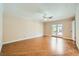 Spacious bedroom with wood floors, ceiling fan, and glass doors leading to the backyard at 6315 Eldora Ave, Las Vegas, NV 89146