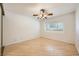 Bright bedroom with wood-look floors and a window with plantation shutters at 6315 Eldora Ave, Las Vegas, NV 89146