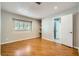 Bedroom with wood floors, recessed lighting, built-in shelves, and bathroom access at 6315 Eldora Ave, Las Vegas, NV 89146