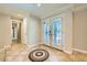 Inviting foyer featuring decorative tile flooring and elegant double doors with glass inserts at 6315 Eldora Ave, Las Vegas, NV 89146