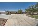 Expansive home with circular driveway, mature trees, and desert landscaping at 6315 Eldora Ave, Las Vegas, NV 89146