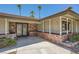 Welcoming covered front porch with decorative brickwork and ornate metal security doors at 6315 Eldora Ave, Las Vegas, NV 89146