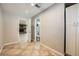 Hallway area featuring tile flooring, neutral paint, and open access to other rooms in the home at 6315 Eldora Ave, Las Vegas, NV 89146
