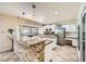 Bright kitchen featuring granite counters, stainless steel appliances, and breakfast bar at 6315 Eldora Ave, Las Vegas, NV 89146