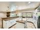 Well-appointed kitchen with granite countertops, center island, and ample cabinet space at 6315 Eldora Ave, Las Vegas, NV 89146