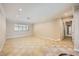 Bright, airy living room with tile floors, crown molding, and a large window at 6315 Eldora Ave, Las Vegas, NV 89146