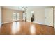 Open main bedroom boasts wood floors, ceiling fan, and backyard access through glass doors at 6315 Eldora Ave, Las Vegas, NV 89146