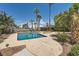 Inviting backyard pool and spa surrounded by lush landscaping and mature palm trees at 6315 Eldora Ave, Las Vegas, NV 89146