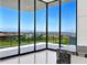 Balcony view showcasing the city and mountain landscape through expansive glass doors at 641 Majestic Rim Dr, Henderson, NV 89012