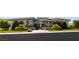 Modern home featuring desert landscaping, a gated entrance, and sleek architectural design at 641 Majestic Rim Dr, Henderson, NV 89012