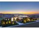 Stunning modern home with beautiful landscaping and breathtaking views at sunset at 641 Majestic Rim Dr, Henderson, NV 89012