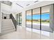 Foyer and staircase lead to an outside pool area with glass sliders at 641 Majestic Rim Dr, Henderson, NV 89012