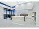 Modern kitchen with marble island, stainless appliances, and expansive windows showcasing city views at 641 Majestic Rim Dr, Henderson, NV 89012