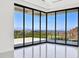 Bright living room with floor to ceiling glass doors and city views at 641 Majestic Rim Dr, Henderson, NV 89012