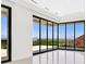 Bright living room with floor to ceiling doors offering city views at 641 Majestic Rim Dr, Henderson, NV 89012