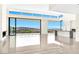 Bright living room boasting modern fireplace, tiled floors, and grand windows showcasing beautiful views at 641 Majestic Rim Dr, Henderson, NV 89012