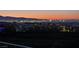 Stunning night view capturing the city skyline and surrounding landscape at 641 Majestic Rim Dr, Henderson, NV 89012