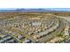 Expansive aerial view of a Primary-planned community with mountain views, showcasing the neighborhood layout at 7051 Denio Island St, North Las Vegas, NV 89084