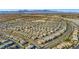 Expansive aerial view of a Primary-planned community with mountain views, showcasing the neighborhood layout at 7051 Denio Island St, North Las Vegas, NV 89084