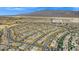 Wide neighborhood aerial view highlighting the street layout and mountains in background at 7051 Denio Island St, North Las Vegas, NV 89084