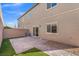 Paver patio and low-maintenance landscaping enhance this home's charming backyard at 7051 Denio Island St, North Las Vegas, NV 89084
