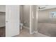 View into a bathroom featuring a toilet and closet at 7051 Denio Island St, North Las Vegas, NV 89084