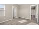 Bedroom featuring carpet flooring, natural light, and open doorway leading to the hallway at 7051 Denio Island St, North Las Vegas, NV 89084