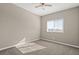 Sunlit bedroom with neutral carpet and a view from the window at 7051 Denio Island St, North Las Vegas, NV 89084