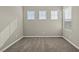 Bedroom with neutral walls, carpet flooring, and bright natural light from multiple windows at 7051 Denio Island St, North Las Vegas, NV 89084