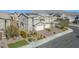 Inviting two-story home featuring a three-car garage and well-manicured landscaping at 7051 Denio Island St, North Las Vegas, NV 89084