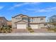 Charming stucco two-story home with a brick driveway and well-maintained landscaping at 7051 Denio Island St, North Las Vegas, NV 89084