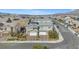 Inviting two-story home featuring a three-car garage and well-manicured landscaping at 7051 Denio Island St, North Las Vegas, NV 89084