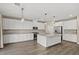 Modern kitchen with granite counters, stainless steel appliances, and a large center island at 7051 Denio Island St, North Las Vegas, NV 89084
