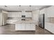 Spacious kitchen features a large center island and stainless-steel appliances at 7051 Denio Island St, North Las Vegas, NV 89084