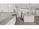 Well-appointed kitchen with granite countertops, white cabinets, and stainless steel appliances at 7051 Denio Island St, North Las Vegas, NV 89084