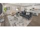 Beautiful living room with stylish furniture and an open floor plan leading to the kitchen at 7051 Denio Island St, North Las Vegas, NV 89084