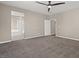 Large main bedroom with carpet, a ceiling fan, and ensuite bathroom at 7051 Denio Island St, North Las Vegas, NV 89084