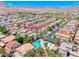 Aerial view of the neighborhood highlighting the community pool, landscaping, and house at 708 Point Bluff Street at 708 Point Bluff St, Henderson, NV 89002