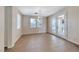 Open-concept dining area with tile floors and sliding patio door to the backyard at 708 Point Bluff St, Henderson, NV 89002