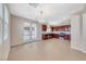 Spacious kitchen with stainless steel appliances, tile flooring, and natural light through the back patio doors at 708 Point Bluff St, Henderson, NV 89002