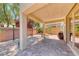 Spacious covered patio with stone columns, gas torch, and built-in barbeque area at 708 Point Bluff St, Henderson, NV 89002