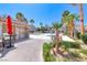 Community pool area with a bathhouse, patio seating, and lush landscaping, providing a resort-like experience at 708 Point Bluff St, Henderson, NV 89002