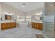 Contemporary bathroom with a freestanding tub, double vanity, and glass shower at 7411 Brittlethorne Ave, Las Vegas, NV 89131
