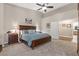 Primary bedroom with high ceilings, large bed, and ensuite bathroom at 7411 Brittlethorne Ave, Las Vegas, NV 89131