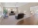 Comfortable living room with plush seating and seamless flow to hardwood floors at 7411 Brittlethorne Ave, Las Vegas, NV 89131
