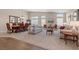 Open-concept living room and dining room area filled with natural light and neutral tones at 7411 Brittlethorne Ave, Las Vegas, NV 89131